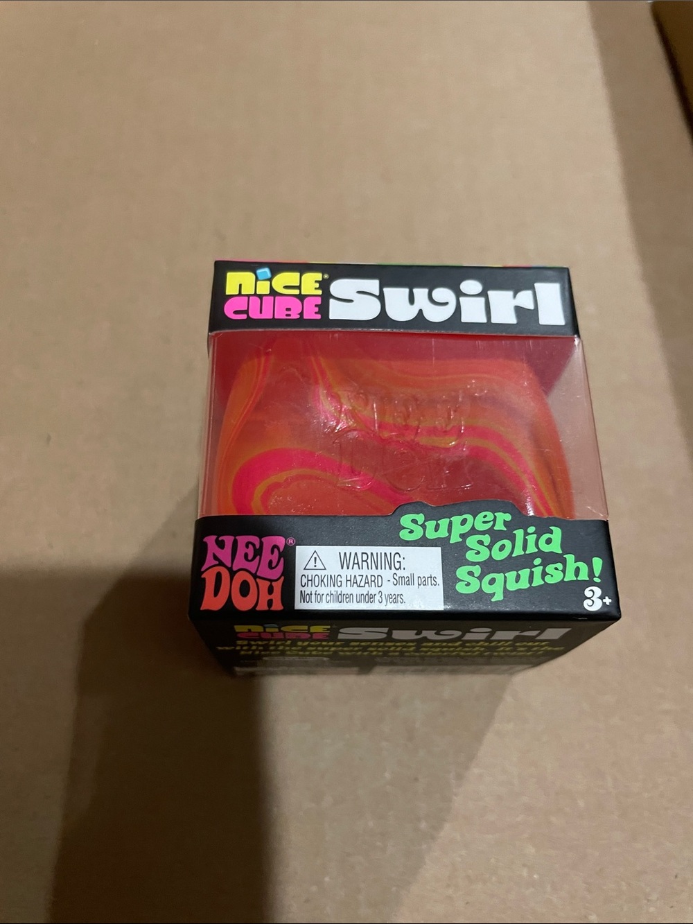 Nee Doh Swirl Squish Cube - Pink and Orange Swirl
